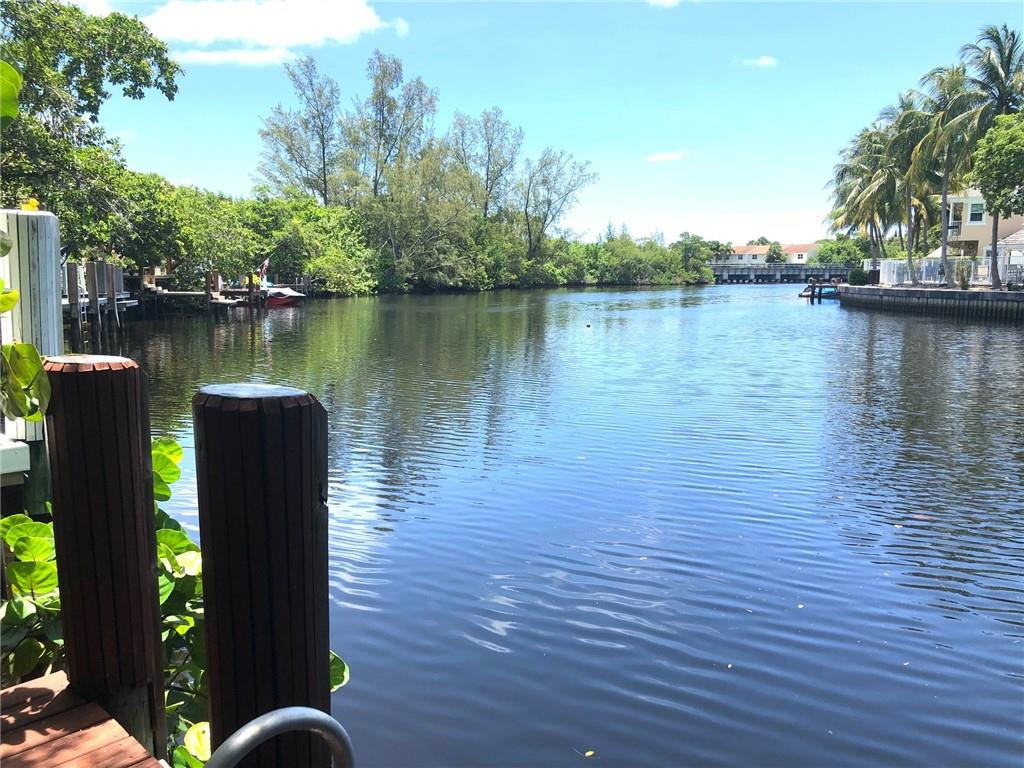 2000 Riverside Place, Unit 4 Wilton Manors, FL 33305 - Photo 24 of 40 a wooden deck with lake view