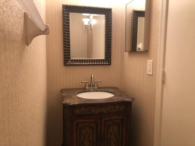 2000 Riverside Place, Unit 4 Wilton Manors, FL 33305 - Photo 26 of 40 a bathroom with a sink and a mirror