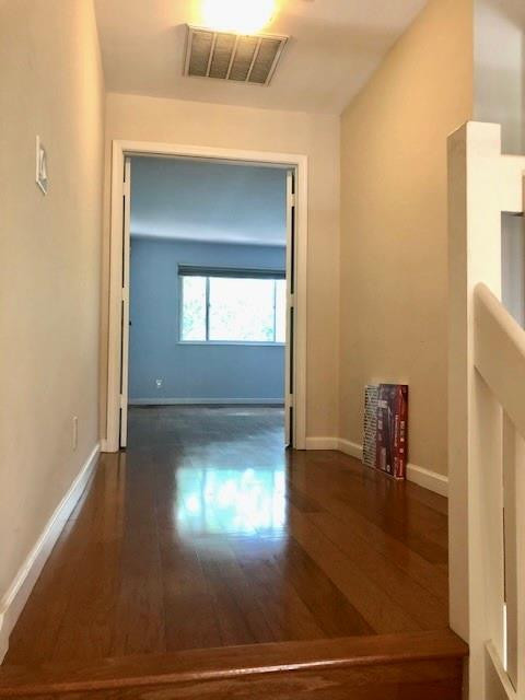 2000 Riverside Place, Unit 4 Wilton Manors, FL 33305 - Photo 28 of 40 a view of a hallway with wooden floor and a chair