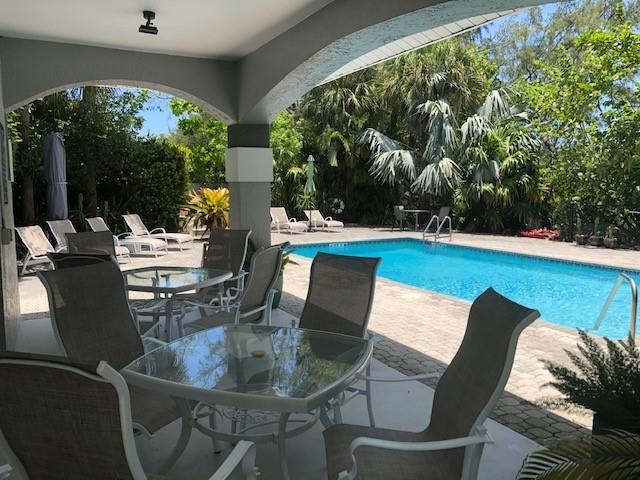 2000 Riverside Place, Unit 4 Wilton Manors, FL 33305 - Photo 38 of 40 a view of a dining room with furniture window and outside view