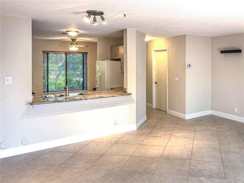 2000 Riverside Place, Unit 4 Wilton Manors, FL 33305 - Photo 4 of 40 a view of an empty room and window