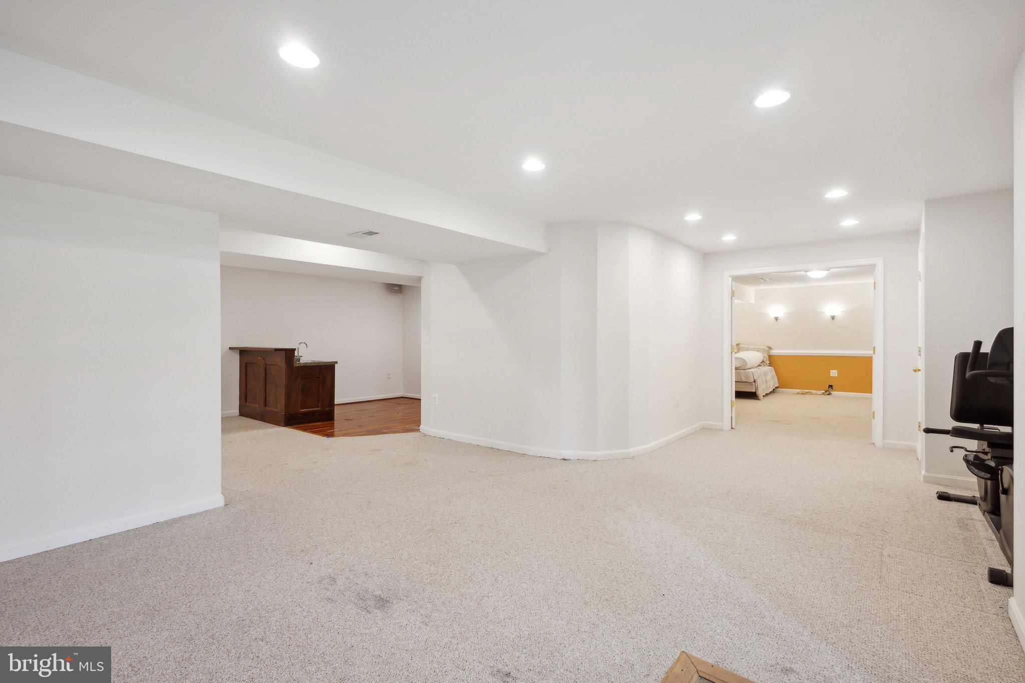 7102 Clarkson Drive Springfield, VA 22150 - Photo 17 of 26 a view of a big room with entryway and a flat screen tv