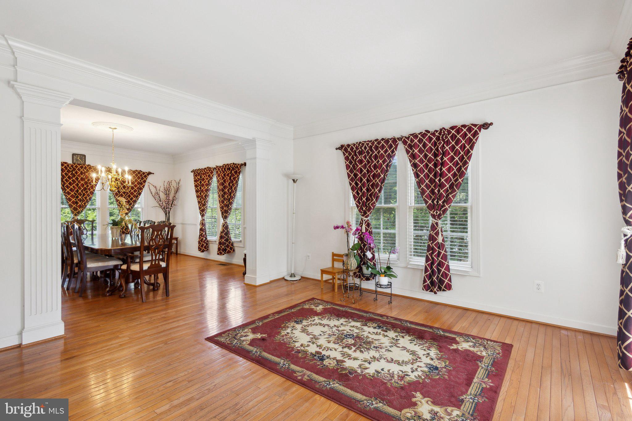 7102 Clarkson Drive Springfield, VA 22150 - Photo 3 of 26 a living room with furniture rug and wooden floor