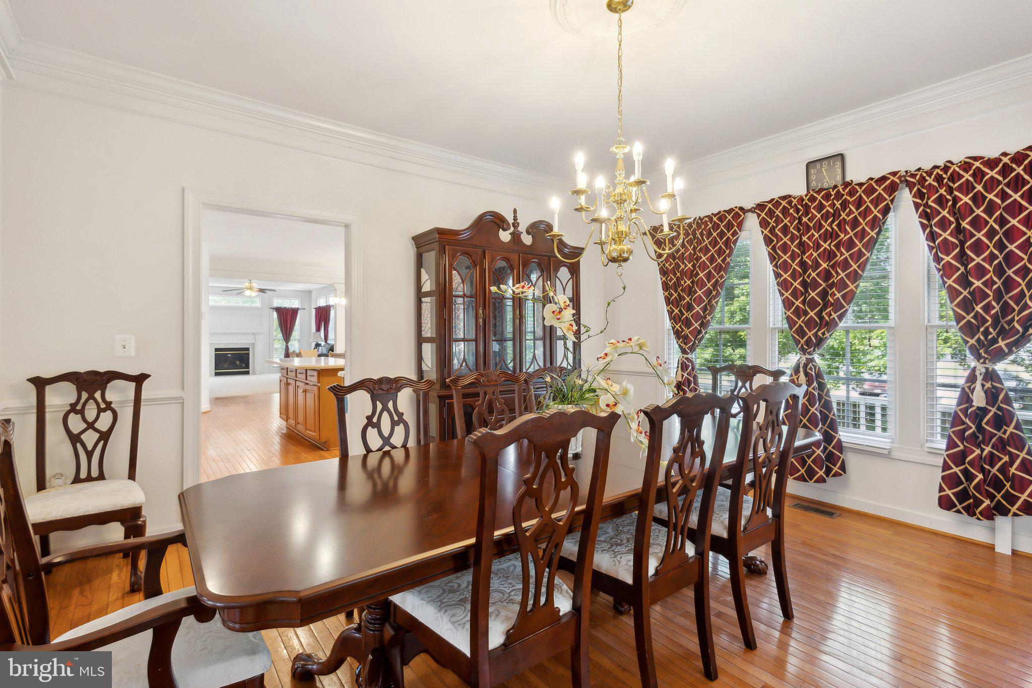 7102 Clarkson Drive Springfield, VA 22150 - Photo 4 of 26 a view of a dining room with furniture window and wooden floor