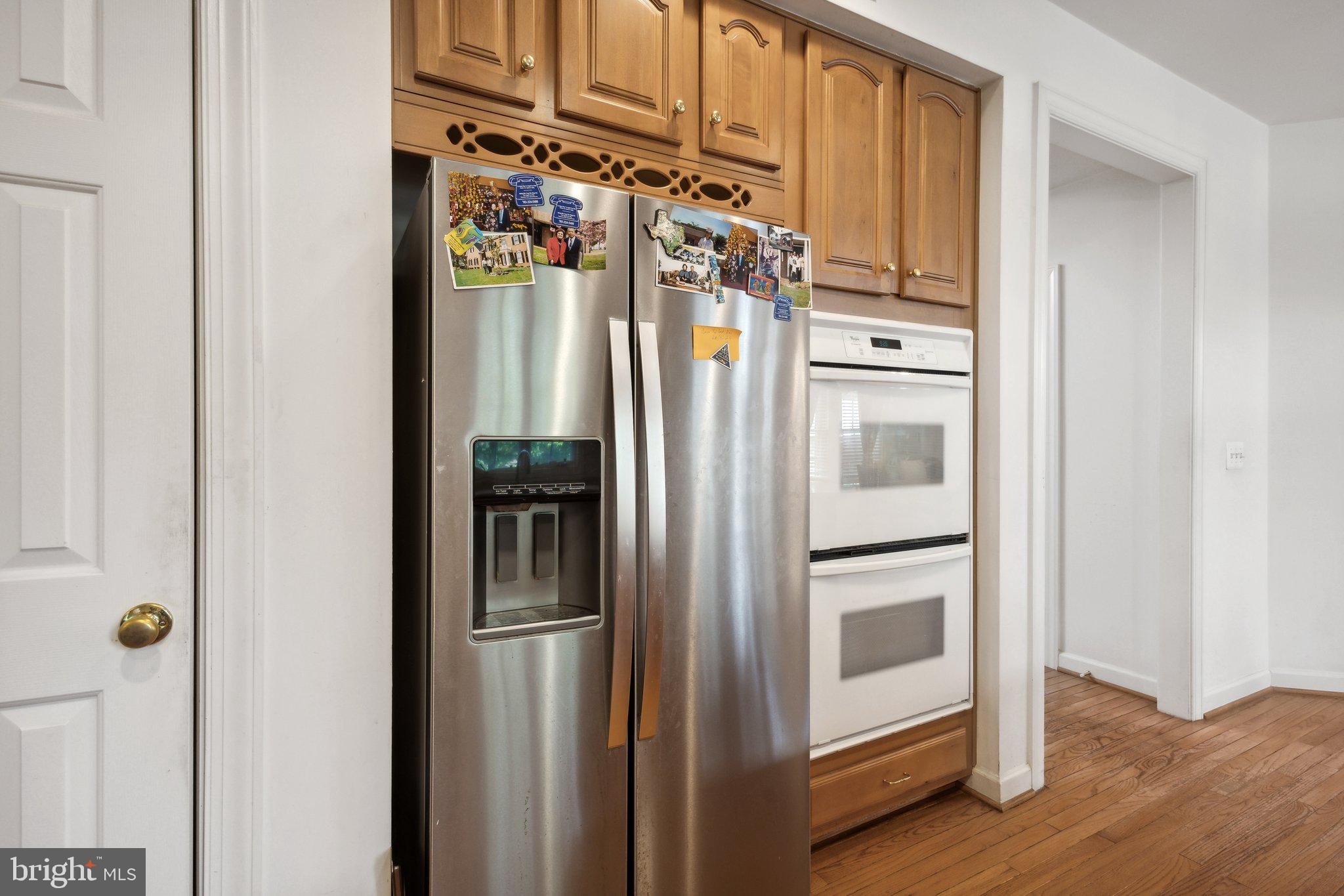 7102 Clarkson Drive Springfield, VA 22150 - Photo 6 of 26 a metallic refrigerator freezer sitting in a kitchen