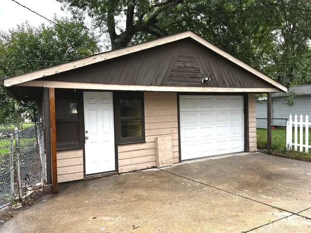 a front view of a house with a garage