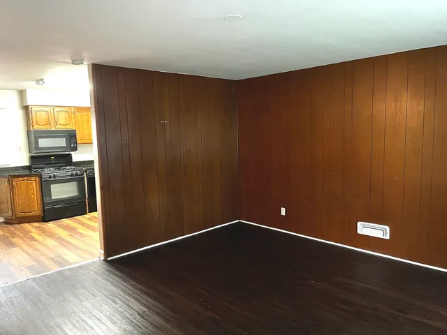 a view of a livingroom with wooden floor