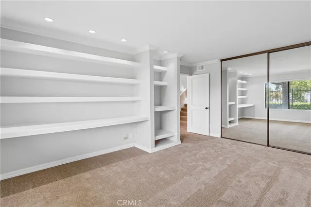 a view of an empty room with glass door