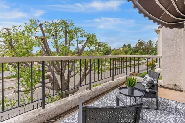 a patio with a patio table and chairs
