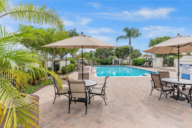 a view of a backyard with plants and lake view