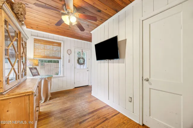 a view of a livingroom with an empty space and a window