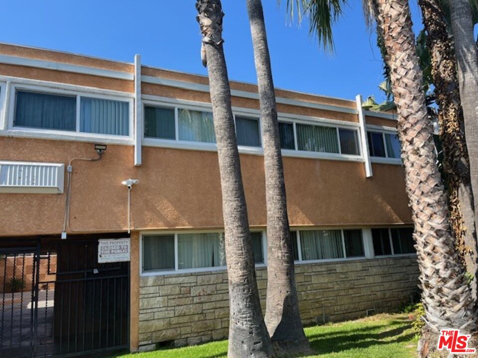 4901 August Street Los Angeles, CA 90008 - Photo 2 of 6 a front view of a house with a yard
