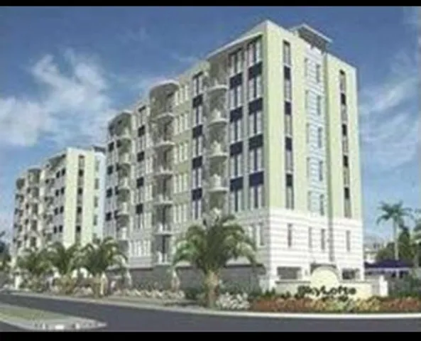 a front view of a building with a yard