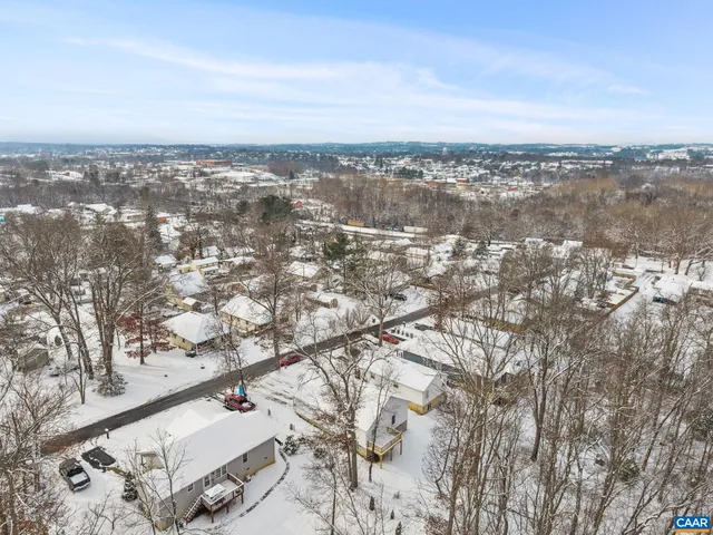 a bathroom with a toilet and a shower curtain