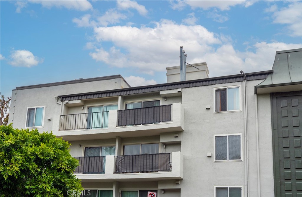 8163 Redlands Street, Unit 73 Playa del Rey, CA 90293 - Photo 2 of 23 a front view of a building with a lot of windows