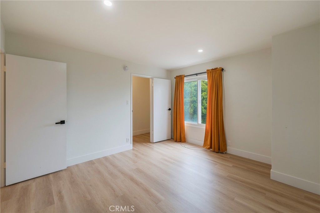 8163 Redlands Street, Unit 73 Playa del Rey, CA 90293 - Photo 8 of 23 a view of an empty room with wooden floor and closet