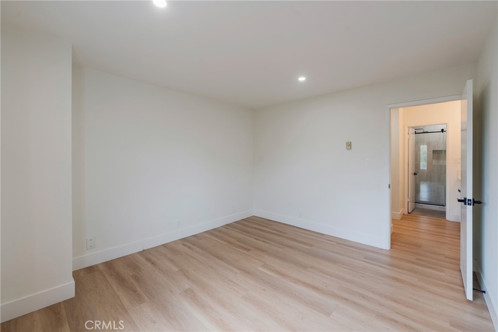 8163 Redlands Street, Unit 73 Playa del Rey, CA 90293 - Photo 9 of 23 a view of a room with wooden floor