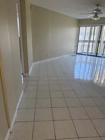 a view of an empty room and window