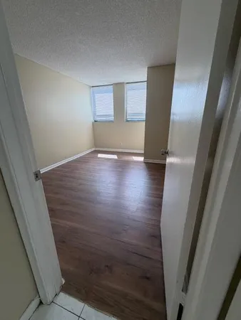 a bathroom with a sink a toilet a mirror and vanity