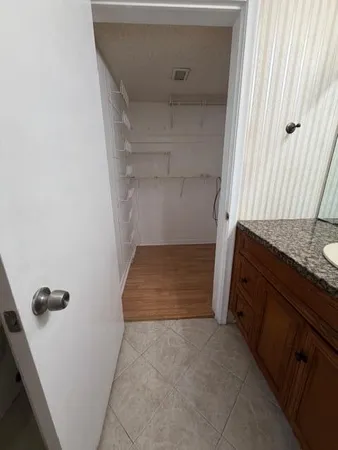 a bathroom with a double vanity sink and mirror