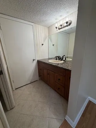 a white toilet sitting next to a bath tub