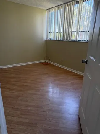 a view of an empty room with a window