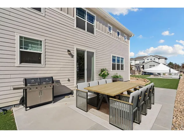 a swimming pool view with a outdoor seating