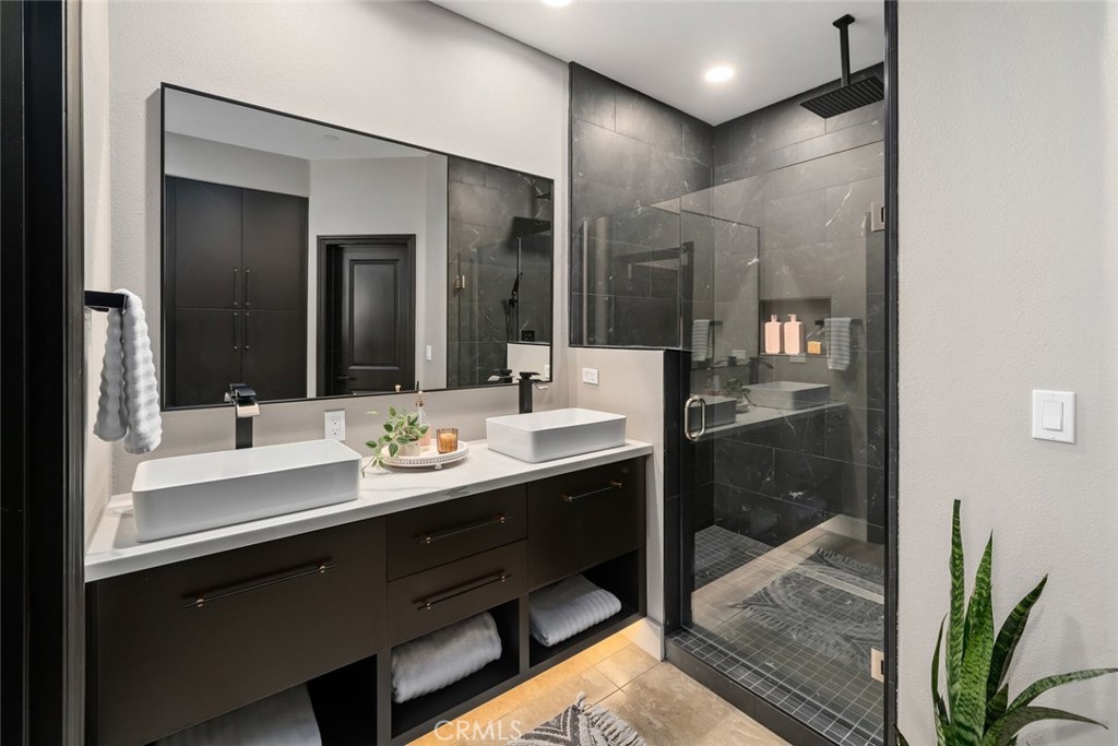 1177 Spring Azure Way, Unit 55 Nipomo, CA 93444 - Photo 25 of 75 a bathroom with a sink and a mirror