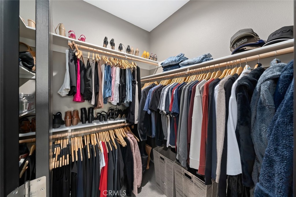 1177 Spring Azure Way, Unit 55 Nipomo, CA 93444 - Photo 27 of 75 a view of walk in closet with clothes and shoes