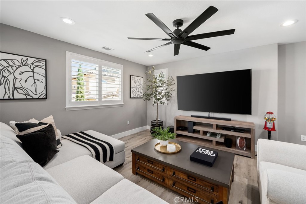 1177 Spring Azure Way, Unit 55 Nipomo, CA 93444 - Photo 30 of 75 a living room with furniture and a flat screen tv