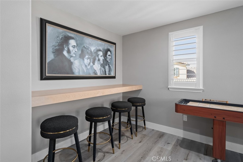 1177 Spring Azure Way, Unit 55 Nipomo, CA 93444 - Photo 32 of 75 a view of a dining room with furniture and wooden floor