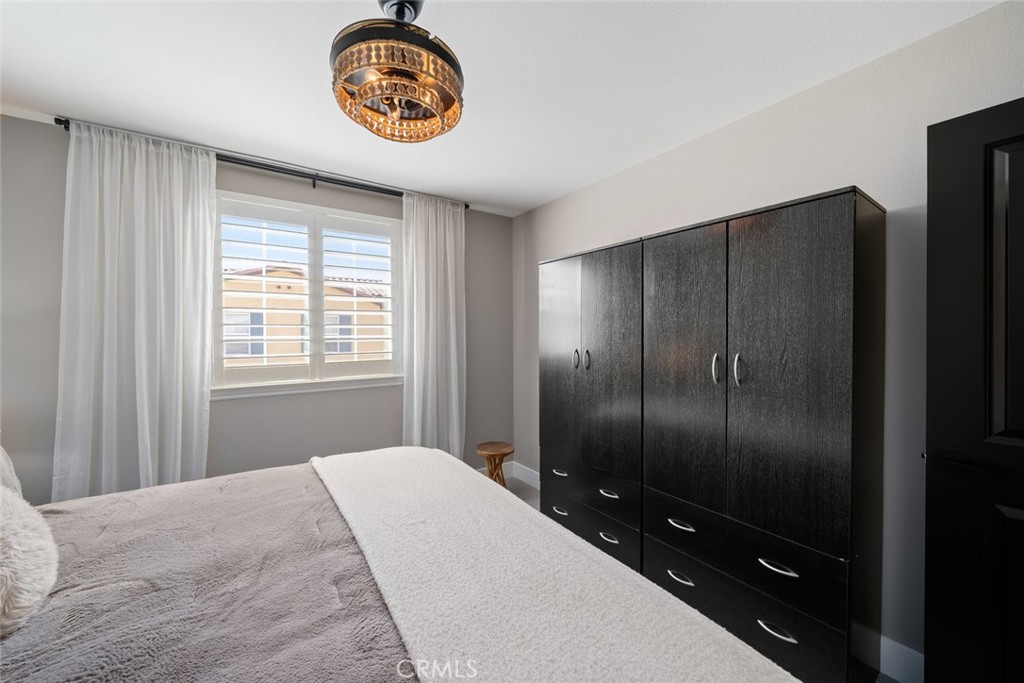 1177 Spring Azure Way, Unit 55 Nipomo, CA 93444 - Photo 35 of 75 a bedroom with a bed and a window