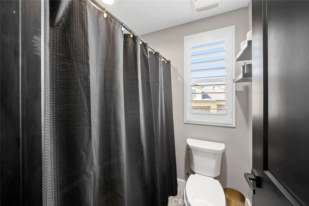 1177 Spring Azure Way, Unit 55 Nipomo, CA 93444 - Photo 38 of 75 a bathroom with a toilet a sink and tub