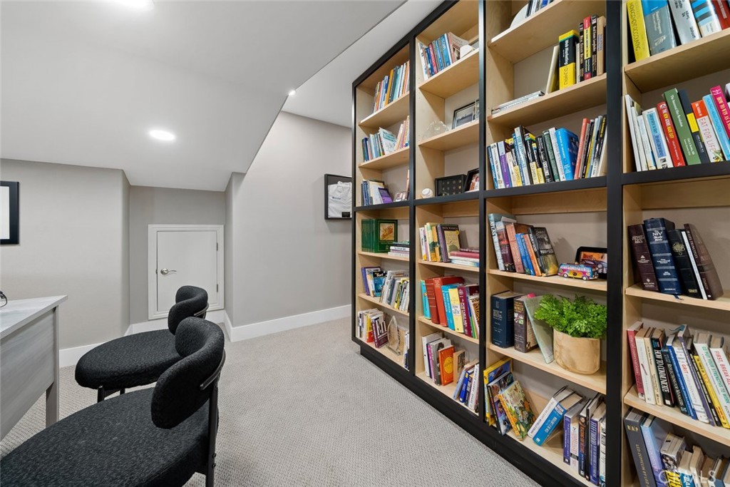 1177 Spring Azure Way, Unit 55 Nipomo, CA 93444 - Photo 43 of 75 a living room with lots of books