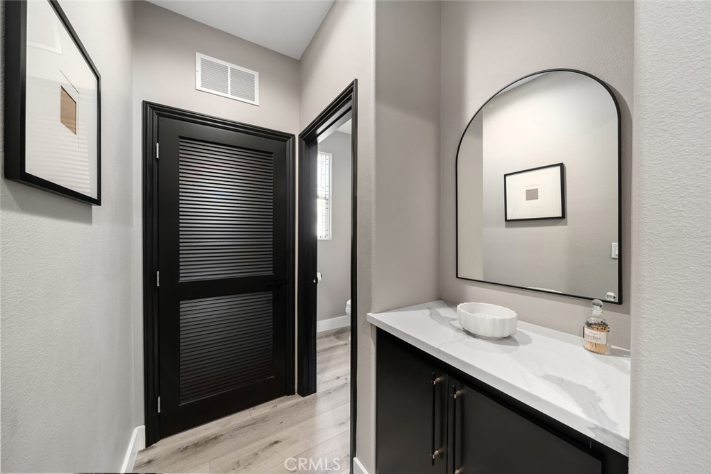 1177 Spring Azure Way, Unit 55 Nipomo, CA 93444 - Photo 49 of 75 a bathroom with a sink and a mirror
