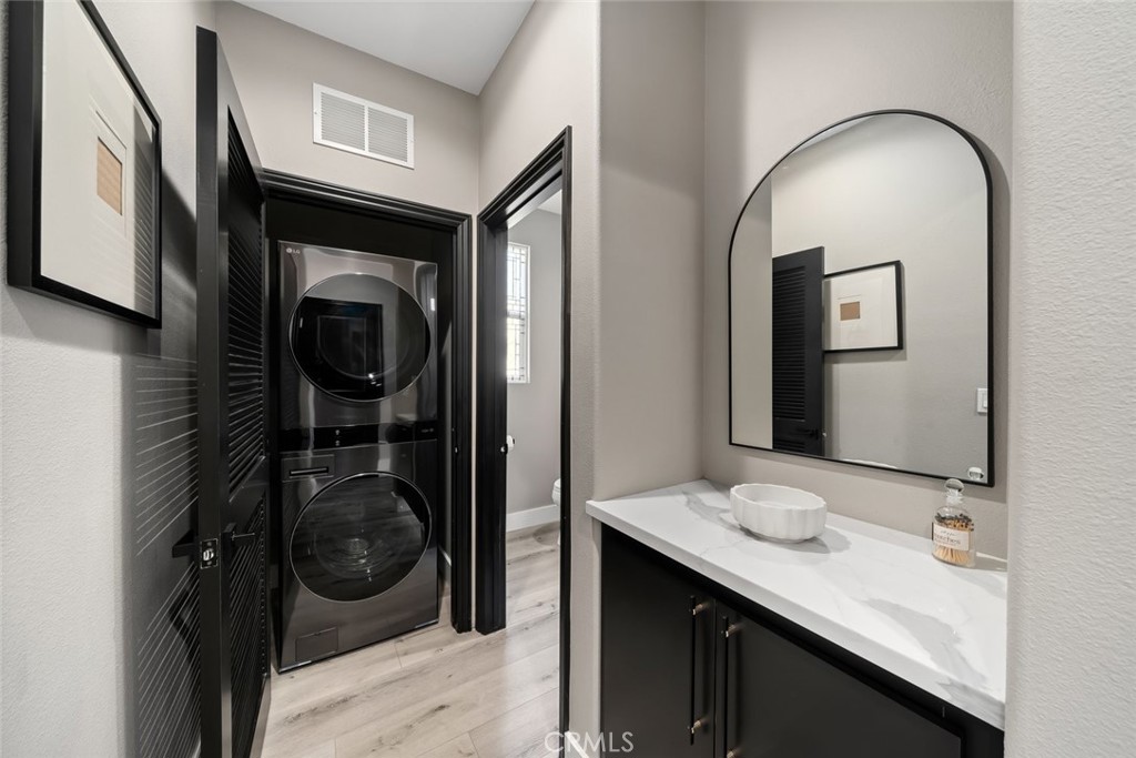 1177 Spring Azure Way, Unit 55 Nipomo, CA 93444 - Photo 50 of 75 a en suite bathroom with a sink and mirror