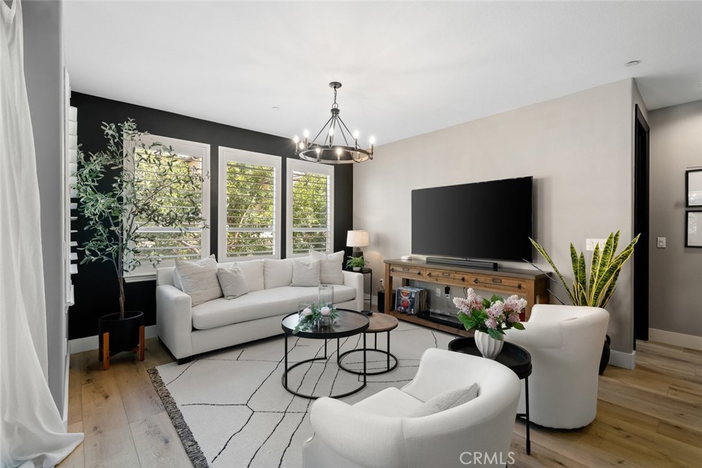 1177 Spring Azure Way, Unit 55 Nipomo, CA 93444 - Photo 5 of 75 a living room with furniture a large window and a flat screen tv