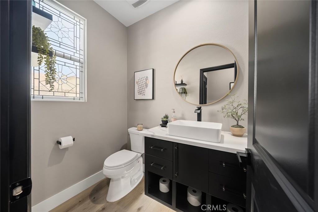 1177 Spring Azure Way, Unit 55 Nipomo, CA 93444 - Photo 51 of 75 a bathroom with a sink toilet and a mirror