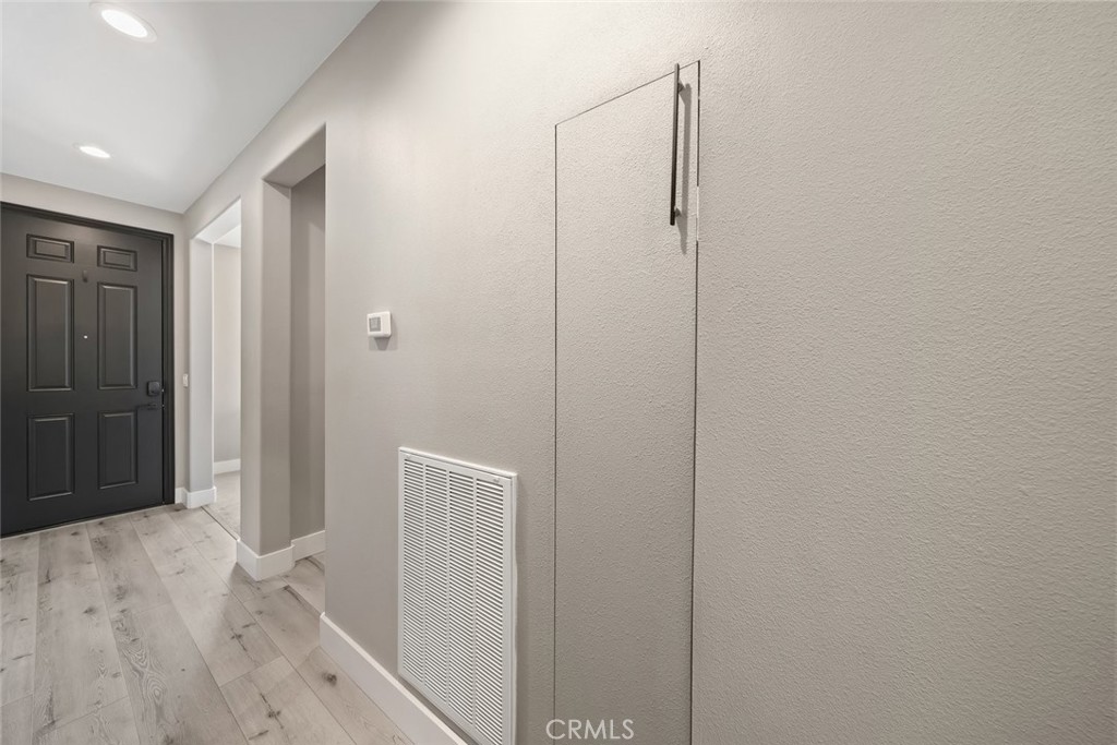 1177 Spring Azure Way, Unit 55 Nipomo, CA 93444 - Photo 52 of 75 a view of hallway with wooden floor