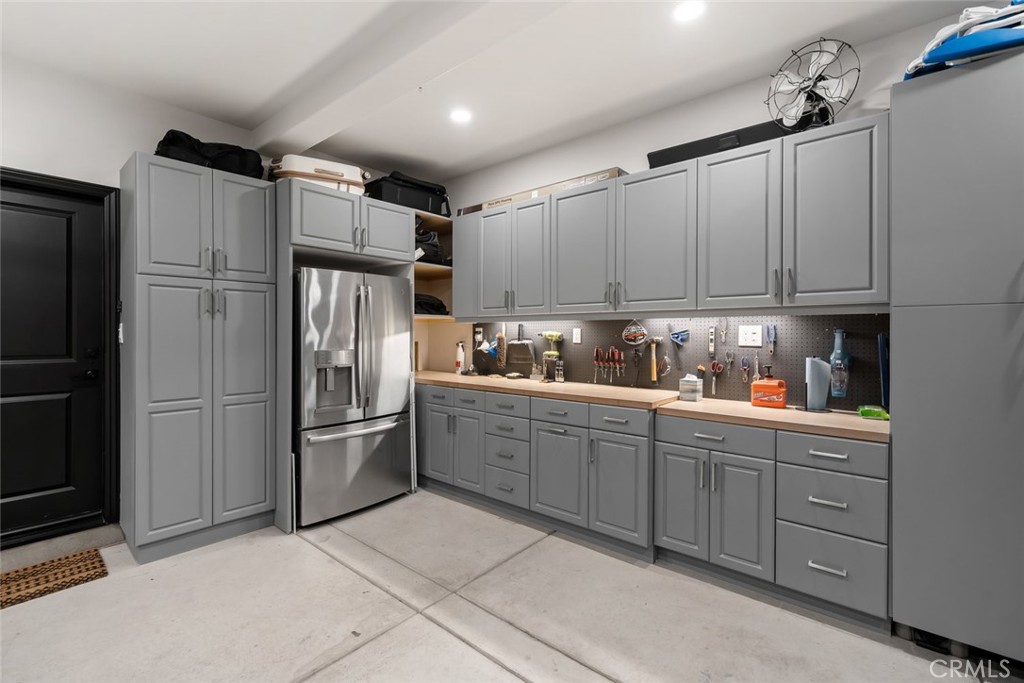 1177 Spring Azure Way, Unit 55 Nipomo, CA 93444 - Photo 56 of 75 a kitchen with stainless steel appliances granite countertop a refrigerator sink and cabinets