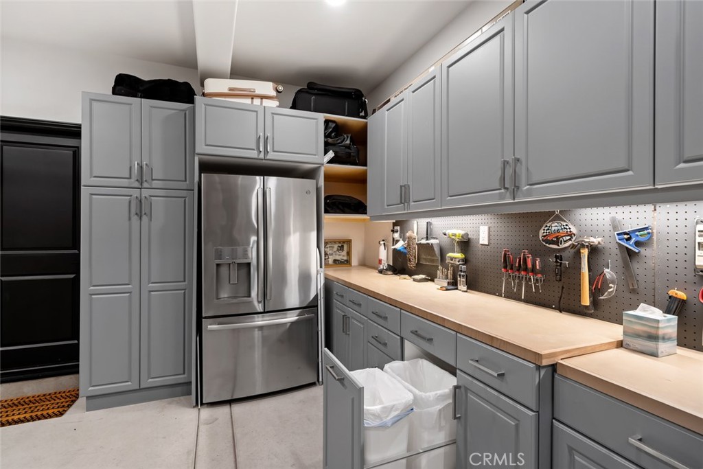 1177 Spring Azure Way, Unit 55 Nipomo, CA 93444 - Photo 57 of 75 a kitchen with stainless steel appliances granite countertop a refrigerator and a sink