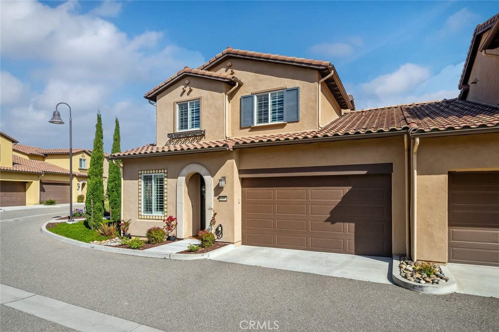 1177 Spring Azure Way, Unit 55 Nipomo, CA 93444 - Photo 59 of 75 a front view of a house with a yard