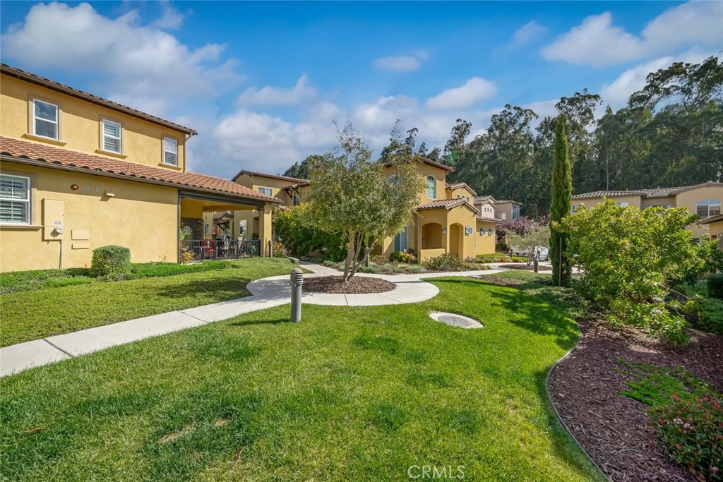 1177 Spring Azure Way, Unit 55 Nipomo, CA 93444 - Photo 60 of 75 a view of a house with a yard and sitting area