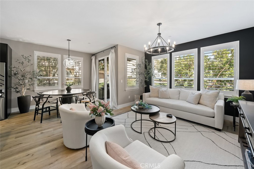 1177 Spring Azure Way, Unit 55 Nipomo, CA 93444 - Photo 6 of 75 a living room with furniture windows and wooden floor
