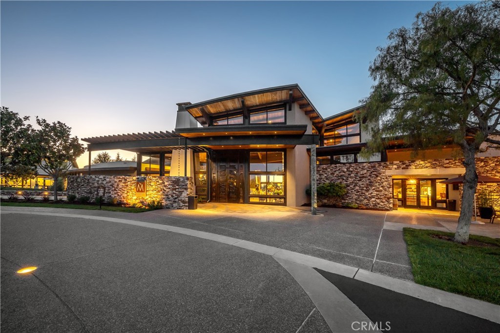 1177 Spring Azure Way, Unit 55 Nipomo, CA 93444 - Photo 63 of 75 a front view of a house with a yard and garage