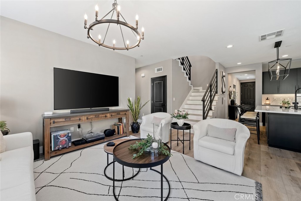 1177 Spring Azure Way, Unit 55 Nipomo, CA 93444 - Photo 7 of 75 a living room with furniture and a flat screen tv