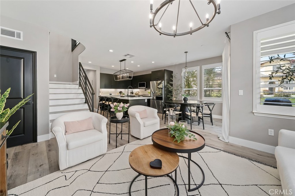 1177 Spring Azure Way, Unit 55 Nipomo, CA 93444 - Photo 8 of 75 a view of a livingroom with furniture and a large window