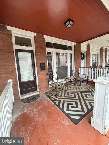 a view of a two chairs in the patio