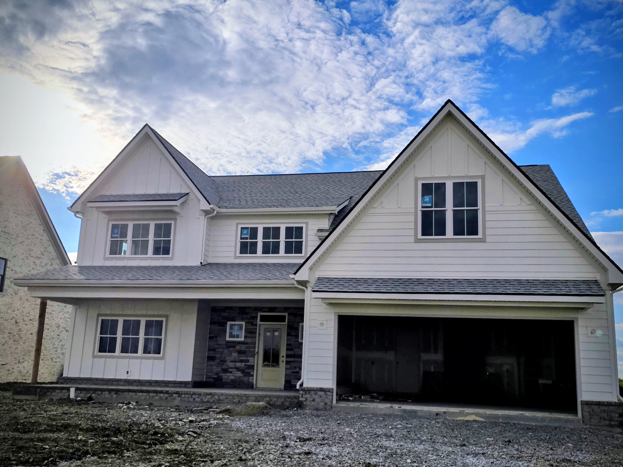 a front view of a house with yard