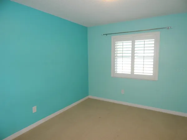 a view of a room that has a window in it